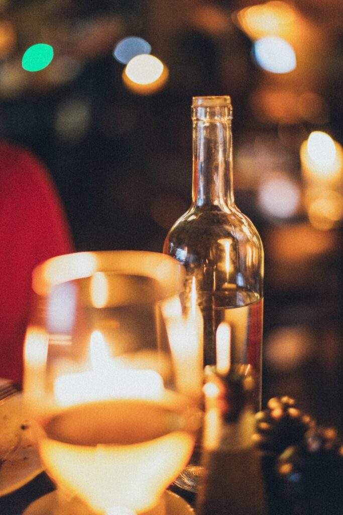 wine bottle and glass with a blurred background