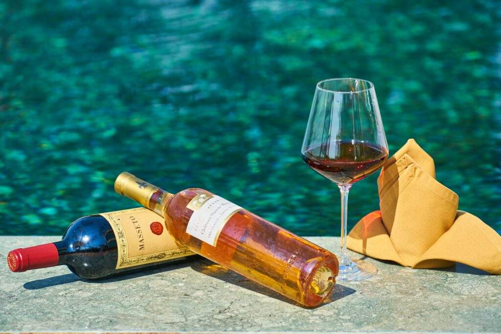 wine bottles around a pool
