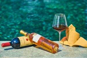 wine bottles around a pool