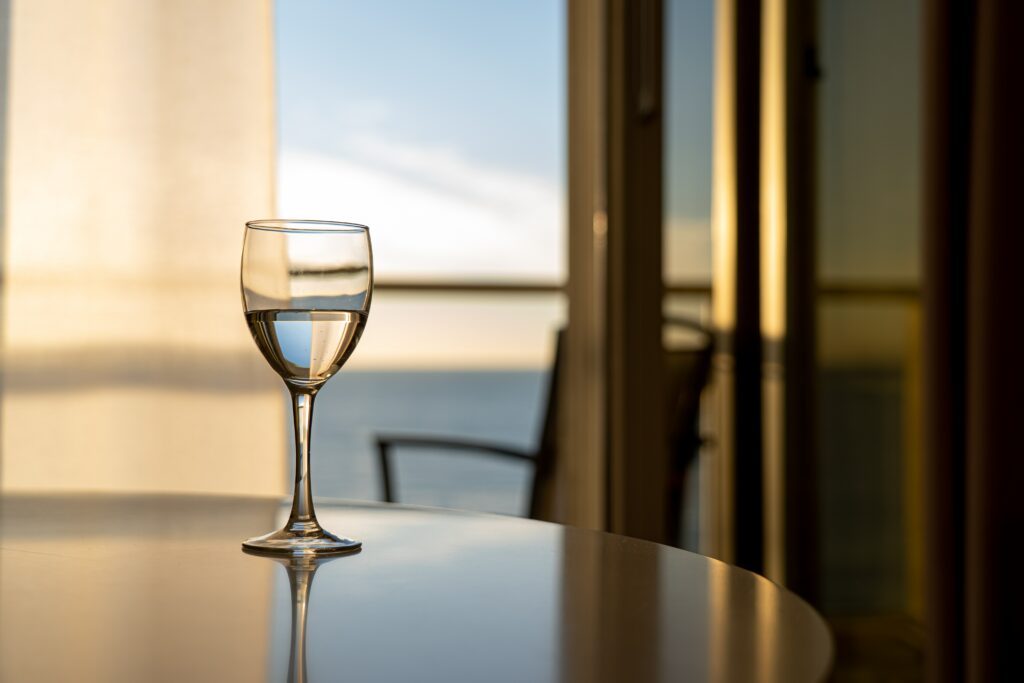 Ideal Wine Company- Wine glass filled on a table