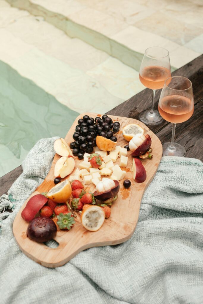 perfect picnic wine pairings, fruit board with wine besides