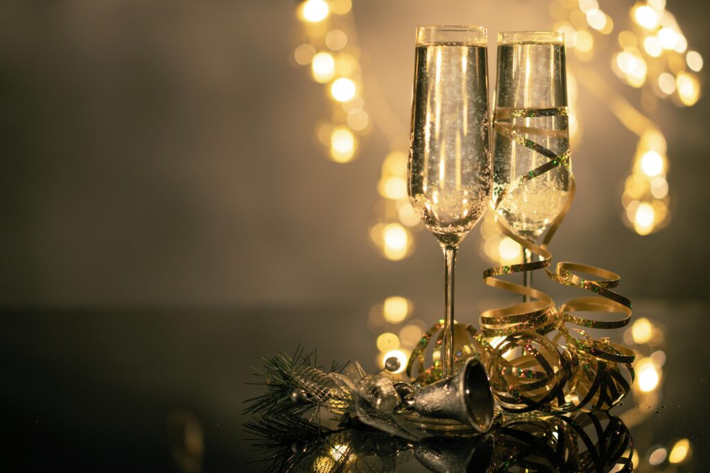 wine glasses with tinsel wrapped around